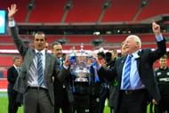 LONDON, ENGLAND - MAY 11:  (L-R) Manager Roberto Martinez of Wigan Athletic and Wigan chairman Dave Whelan celebrate with the trophy following his team's 1-0 victory during the FA Cup with Budweiser Final between Manchester City and Wigan Athletic at Wembley Stadium on May 11, 2013 in London, England.  (Photo by Shaun Botterill/Getty Images)